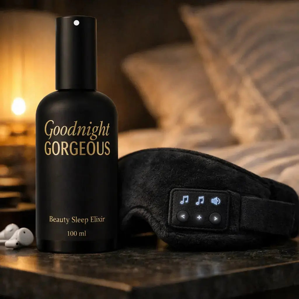 Black bottle labeled 'Goodnight Gorgeous' with a sleep mask on a wooden surface.